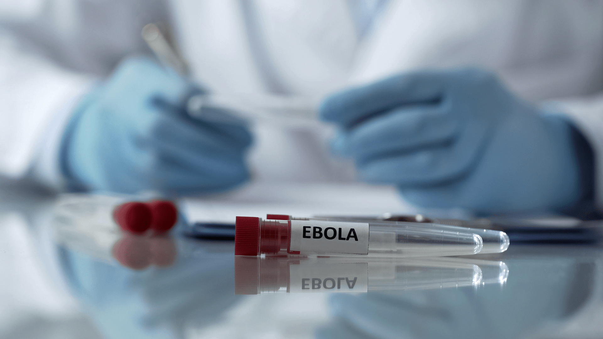 Worker of center for disease control describing effects of ebola virus mutation