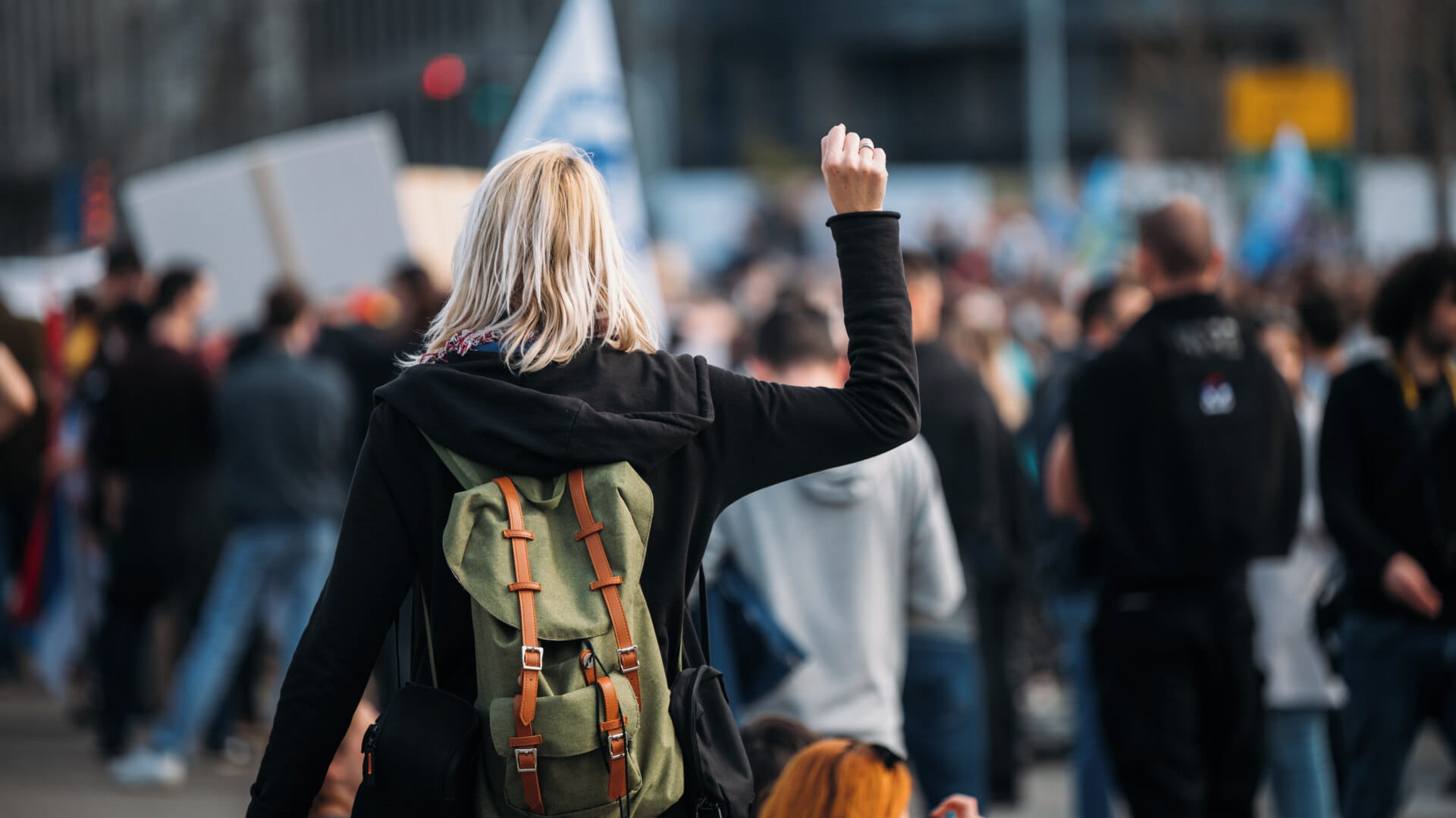 A woman raising her fist during a strike