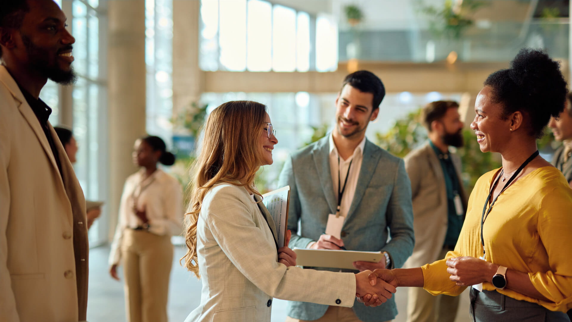 Business professionals interacting and networking during an informal happy hour event.